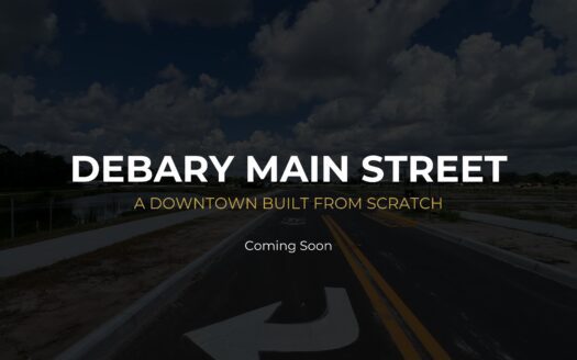 DeBary Main Street construction progress showing new roadway and stormwater pond near Shell Road