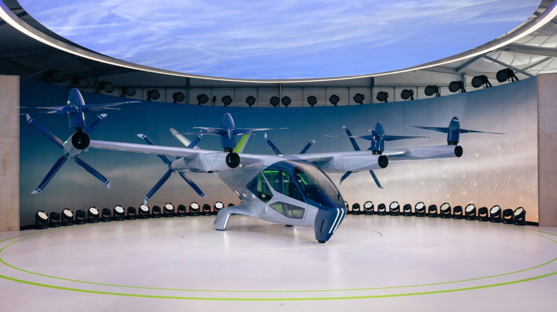 eVTOL electric air taxi aircraft on display, illustrating the future air taxi technology planned for Camping World Stadium's proposed parking garage