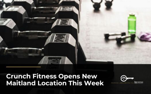 Rows of hexagonal dumbbells on a weight rack in a modern gym, with kettlebells and a water bottle in the background.