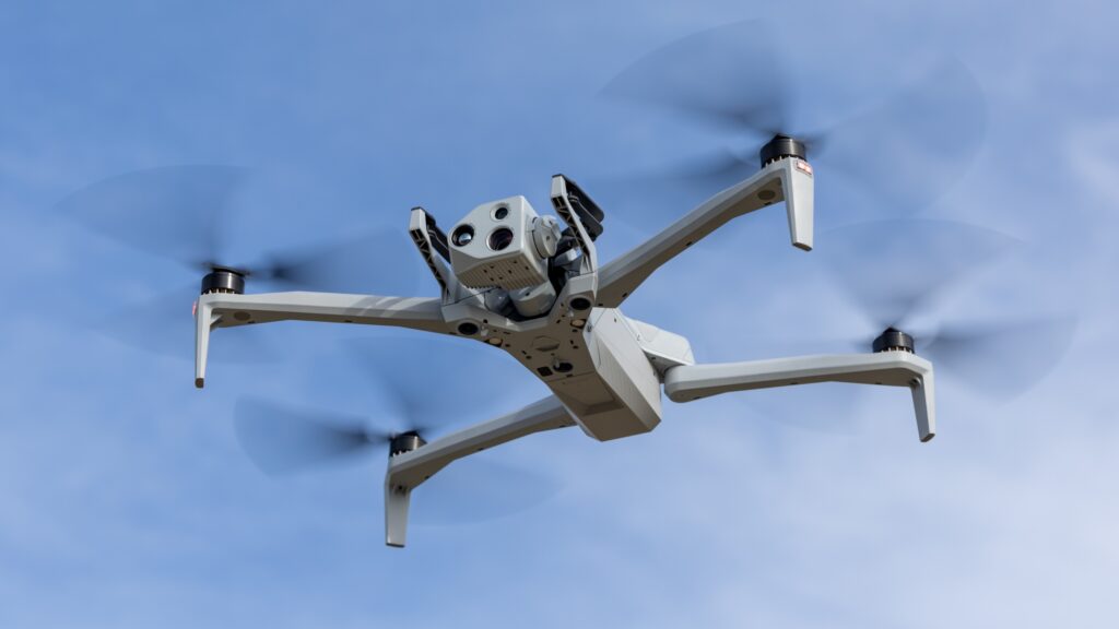 Skydio X10 drone in flight against a blue sky, featured image for Lake Nona building hosting OPD emergency drone stations.
