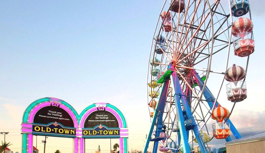 Old Town Kissimmee's Ferris wheel and colorful entrance arches, sold for $24.5 million