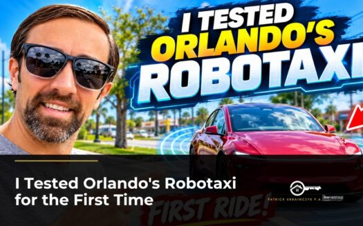 Patrick Urbainczyk next to a red Tesla robotaxi in Orlando, first ride review