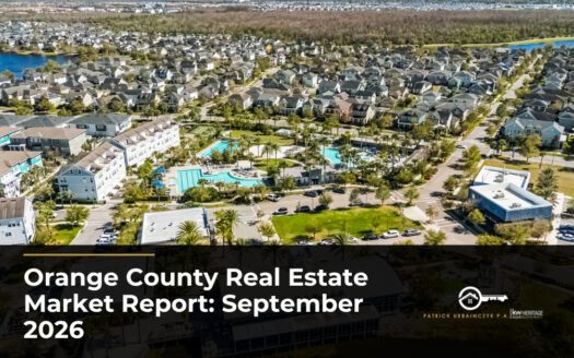 Aerial view of an Orange County neighborhood with townhomes, single-family homes, and a community pool