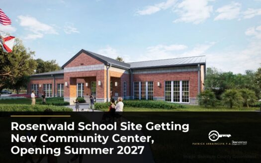 Rendering of the new Rosenwald Community Center, a brick building with a metal roof and covered entrance, at the historic Rosenwald School site in East Altamonte