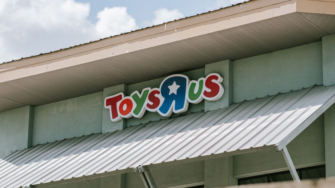 Toys"R"Us sign on the front of a store building